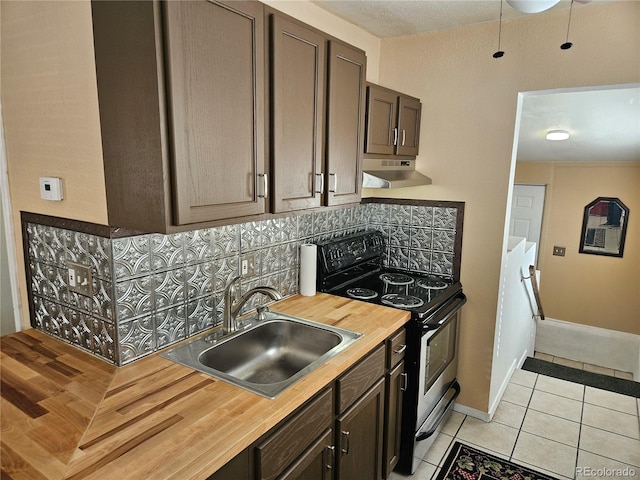 kitchen featuring dark brown cabinetry, sink, backsplash, stainless steel electric range, and light tile patterned floors