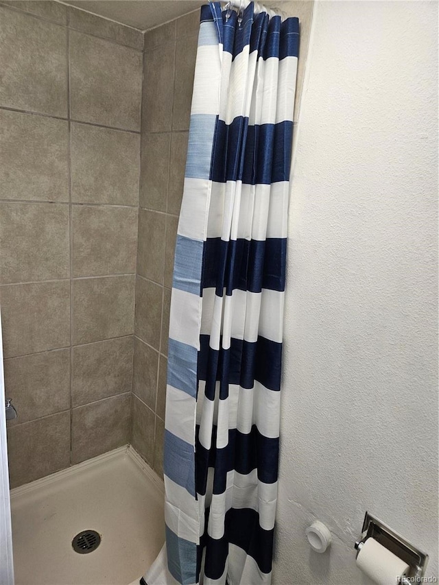 bathroom with a shower with curtain