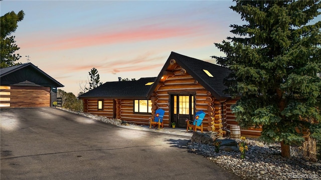 1651 Pine Valley Rd, Evergreen, CO 80439 - log-style house with log siding and a garage