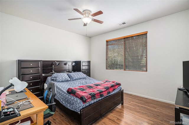 19628 E 58th Pl, Aurora, CO 80019 - bedroom with wood finished floors, baseboards, an office area, and a ceiling fan