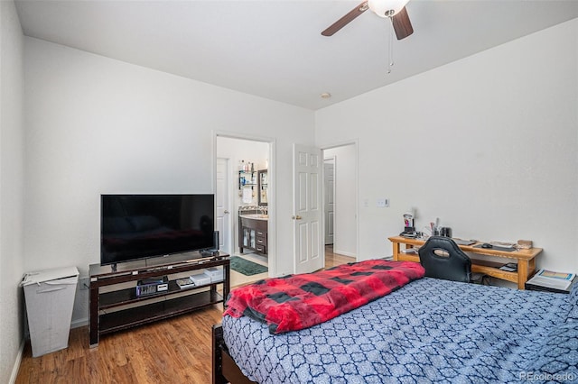 19628 E 58th Pl, Aurora, CO 80019 - bedroom featuring wood finished floors, baseboards, connected bathroom, and ceiling fan