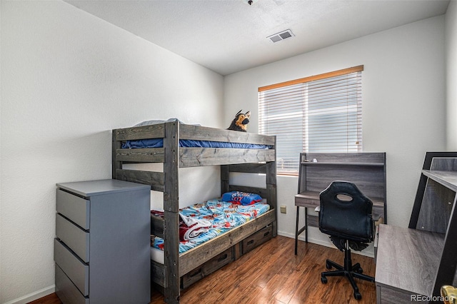 19628 E 58th Pl, Aurora, CO 80019 - bedroom with wood finished floors and baseboards
