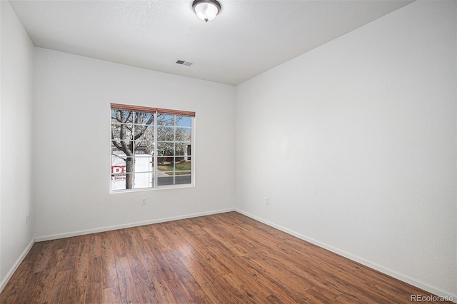 19628 E 58th Pl, Aurora, CO 80019 - spare room featuring wood finished floors and baseboards
