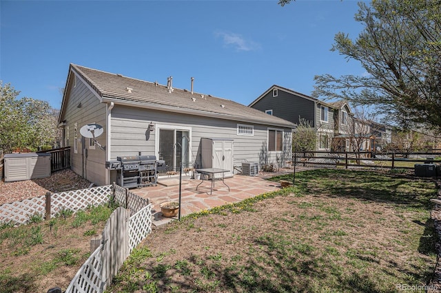 19628 E 58th Pl, Aurora, CO 80019 - rear view of house with a patio, a fenced backyard, and central AC unit