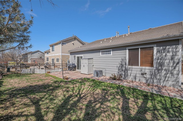 19628 E 58th Pl, Aurora, CO 80019 - back of property with a patio and cooling unit