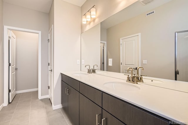 full bathroom featuring visible vents, a sink, and tile patterned floors