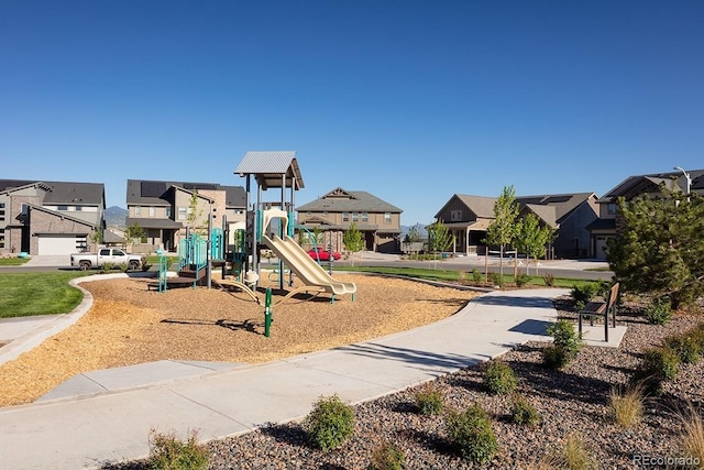 community jungle gym featuring a residential view