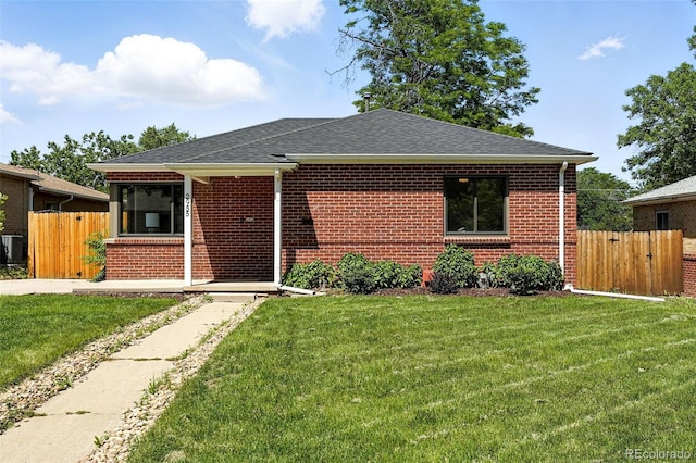 2955 Poplar St, Denver, CO 80207 - view of front of house featuring brick siding and a shingled roof