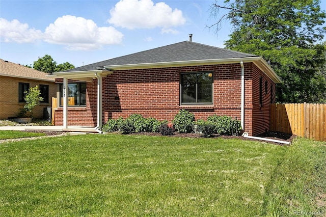 2955 Poplar St, Denver, CO 80207 - view of front facade with brick siding and a shingled roof