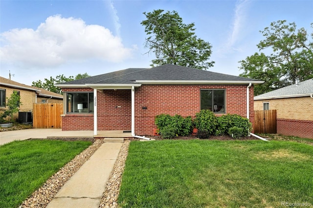 2955 Poplar St, Denver, CO 80207 - view of front facade featuring brick siding and a shingled roof
