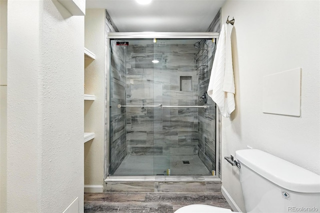 2955 Poplar St, Denver, CO 80207 - full bathroom with wood finished floors and a shower stall