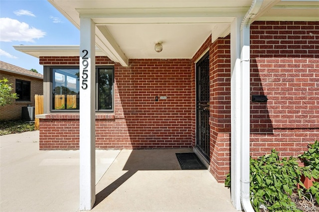 2955 Poplar St, Denver, CO 80207 - doorway to property with brick siding
