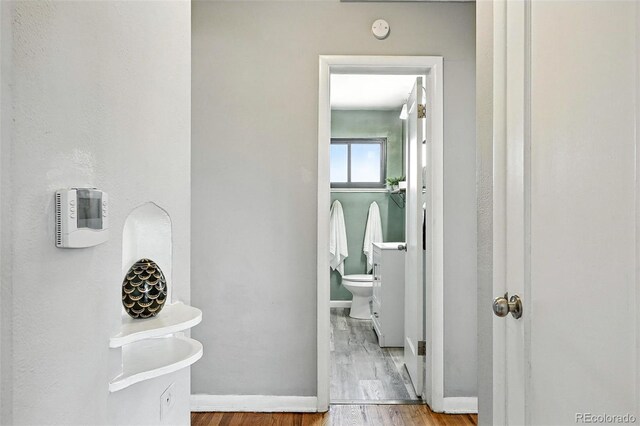 2955 Poplar St, Denver, CO 80207 - bathroom with toilet and wood finished floors