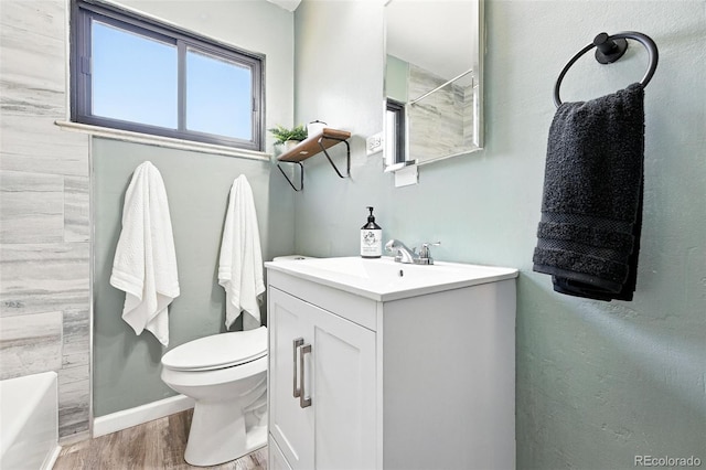 2955 Poplar St, Denver, CO 80207 - full bath with vanity, wood finished floors, a tub to relax in, and a shower