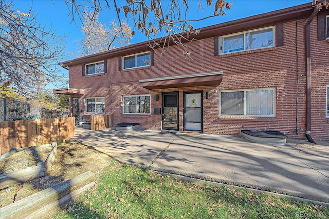 rear view of house featuring a patio