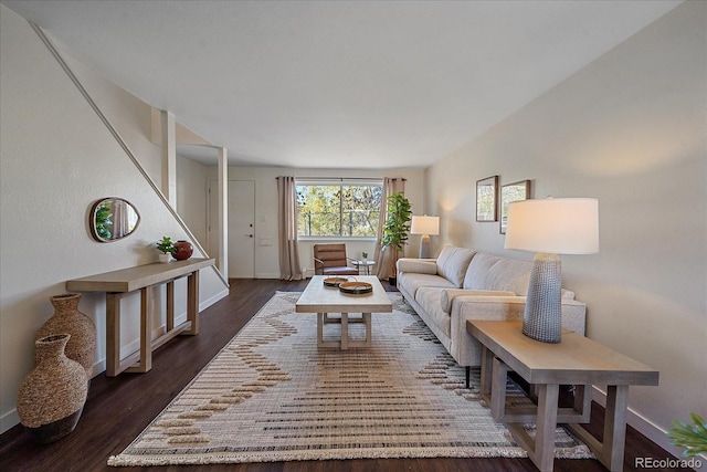 living room with dark hardwood / wood-style floors