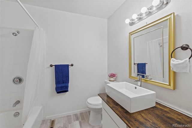 1422 N Chelton Rd, Colorado Springs, CO 80909 - bathroom with toilet, wood finished floors, shower / bath combo with shower curtain, and vanity