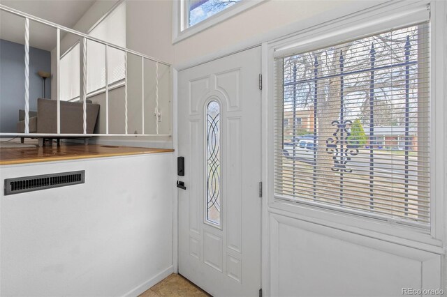1422 N Chelton Rd, Colorado Springs, CO 80909 - entryway with light tile patterned floors