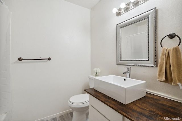 1422 N Chelton Rd, Colorado Springs, CO 80909 - bathroom with toilet, wood finished floors, a shower with curtain, and vanity
