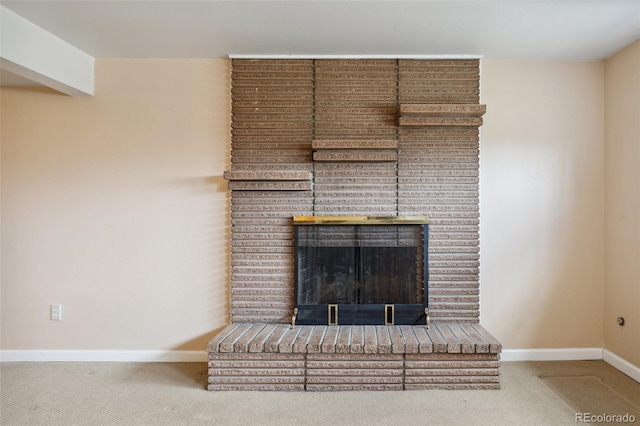 1422 N Chelton Rd, Colorado Springs, CO 80909 - detailed view of carpet floors, baseboards, and a brick fireplace