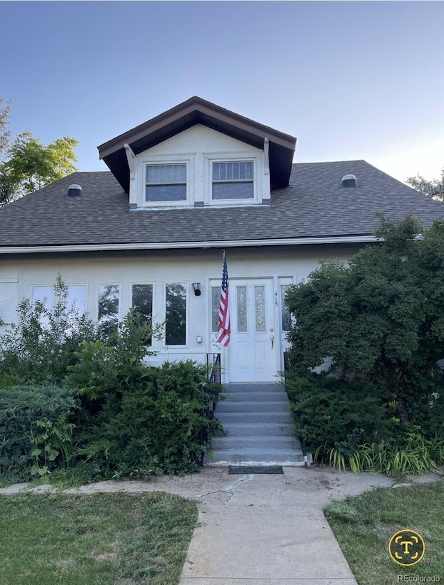 415 N Division Ave, Sterling, CO 80751 - view of front of house featuring a shingled roof and entry steps