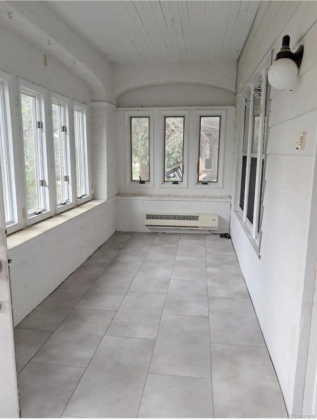 415 N Division Ave, Sterling, CO 80751 - unfurnished sunroom with french doors and a baseboard heating unit