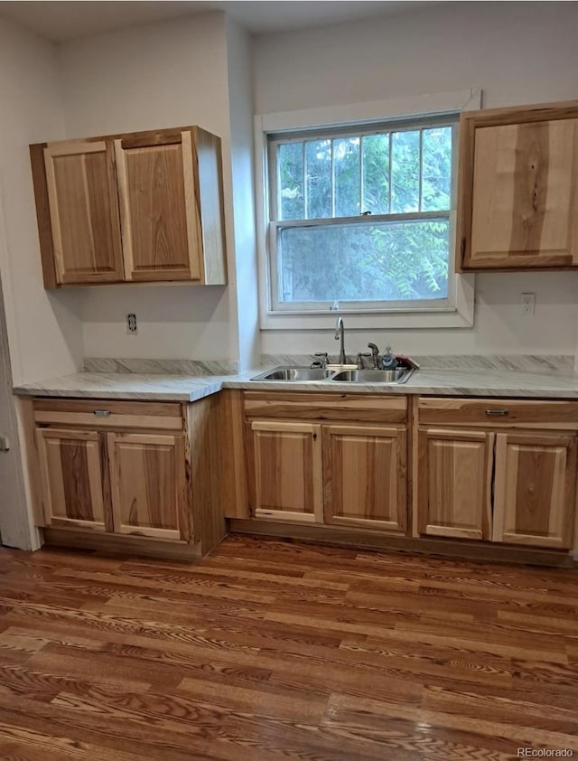 415 N Division Ave, Sterling, CO 80751 - kitchen with dark wood-style flooring, light countertops, and light brown cabinets