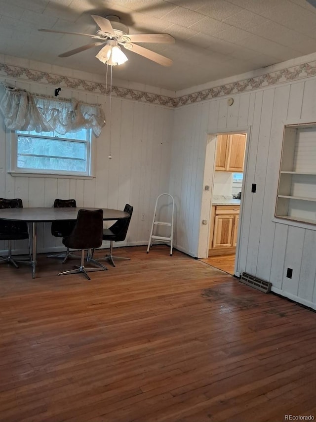 415 N Division Ave, Sterling, CO 80751 - office with wood finished floors, a ceiling fan, and wooden walls