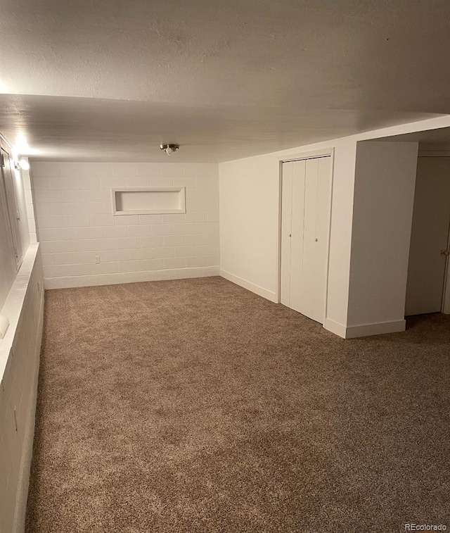 415 N Division Ave, Sterling, CO 80751 - finished basement featuring carpet flooring, concrete block wall, and a textured ceiling