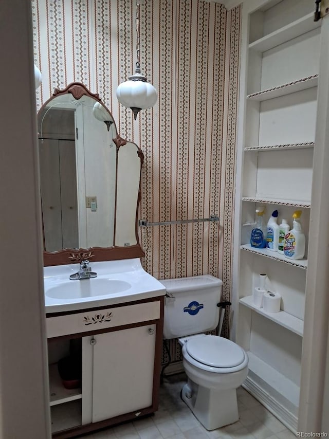 415 N Division Ave, Sterling, CO 80751 - bathroom featuring vanity and tile patterned flooring