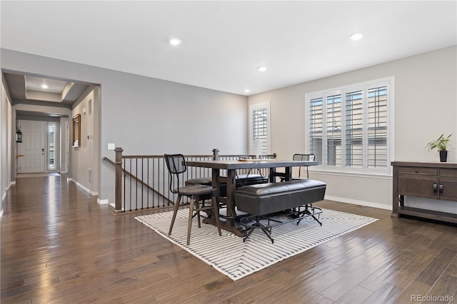 dining room with recessed lighting, baseboards, and wood finished floors