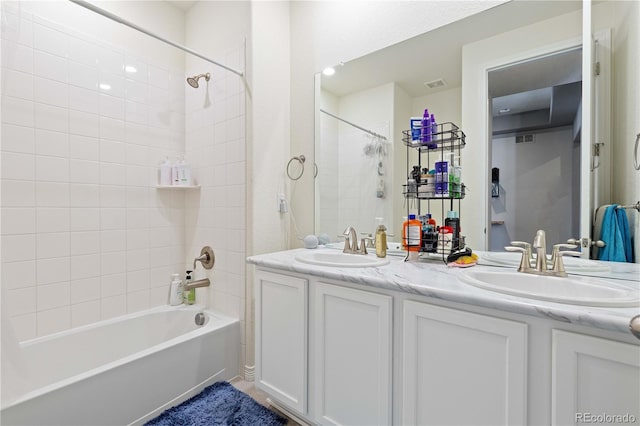 full bathroom featuring double vanity, visible vents,  shower combination, and a sink