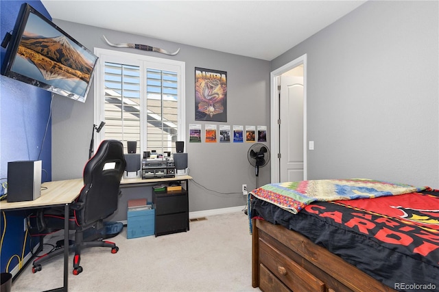 bedroom featuring light carpet and baseboards