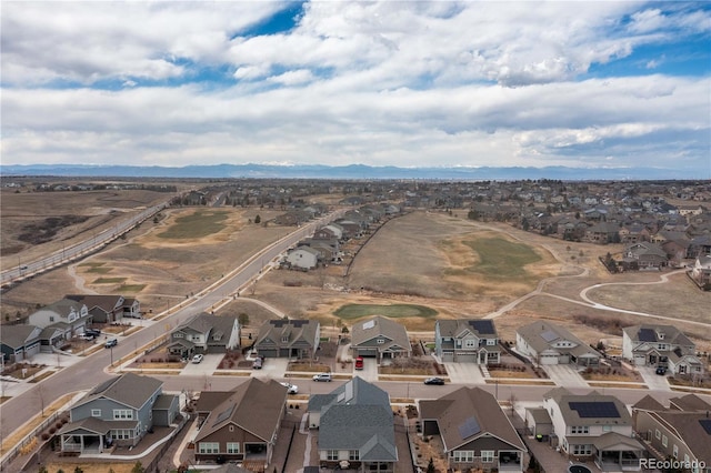 birds eye view of property with a residential view and a mountain view