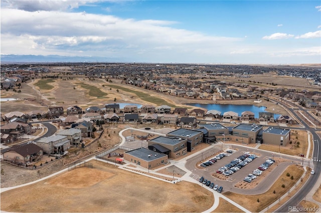 birds eye view of property with a water view and a residential view