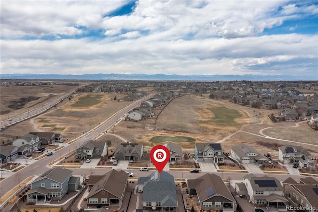 bird's eye view featuring a residential view and a mountain view