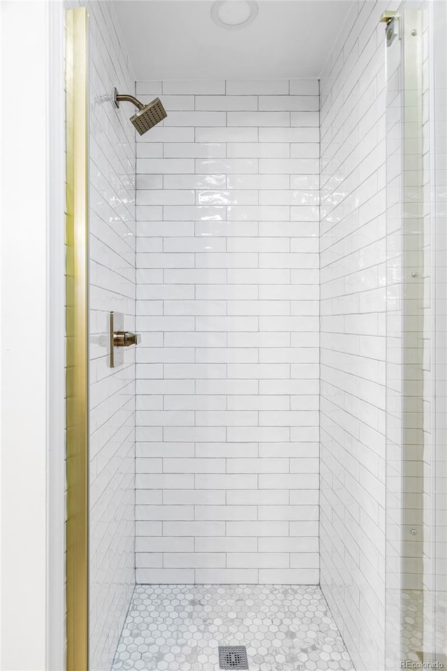 bathroom with tiled shower