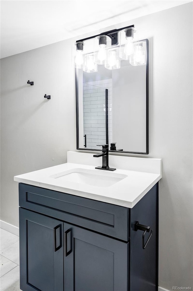 bathroom featuring tile patterned flooring and vanity