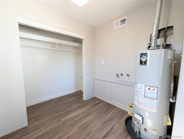 utilities with visible vents and water heater