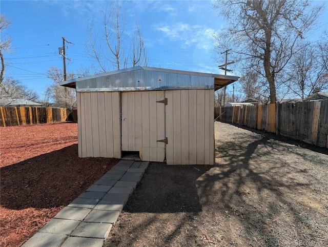 view of shed with a fenced backyard