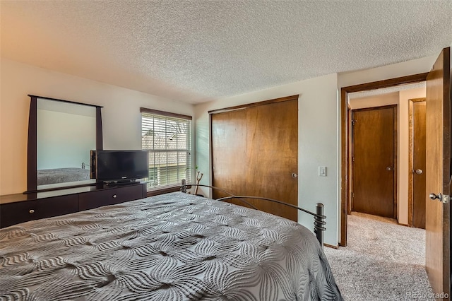 2090 S Hannibal Way Unit F, Aurora, CO 80013 - carpeted bedroom featuring a textured ceiling and a closet