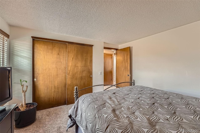 2090 S Hannibal Way Unit F, Aurora, CO 80013 - carpeted bedroom featuring a textured ceiling and a closet