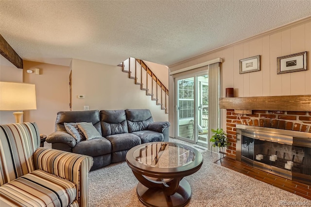 2090 S Hannibal Way Unit F, Aurora, CO 80013 - living area featuring carpet flooring, a textured ceiling, stairs, and a fireplace
