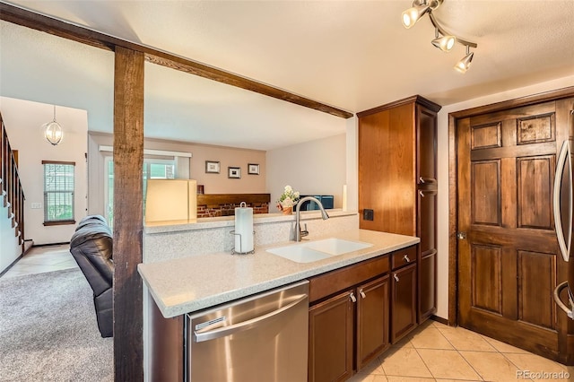 2090 S Hannibal Way Unit F, Aurora, CO 80013 - kitchen with stainless steel dishwasher, a sink, light tile patterned floors, and open floor plan