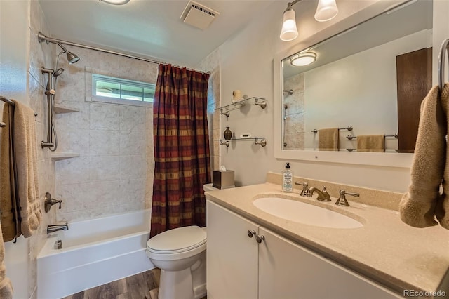 2090 S Hannibal Way Unit F, Aurora, CO 80013 - full bath featuring visible vents, shower / bath combo, wood finished floors, vanity, and toilet