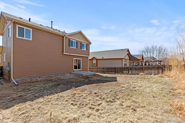 rear view of property with fence