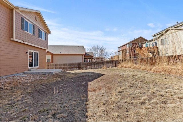 view of yard with a residential view and fence