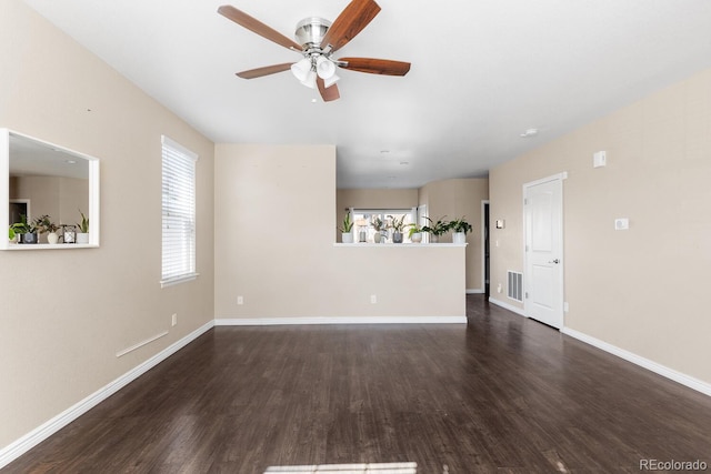 unfurnished living room with visible vents, ceiling fan, baseboards, and wood finished floors