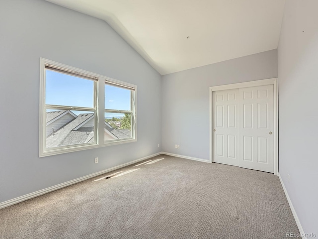 30 Garfield St Unit B, Denver, CO 80206 - unfurnished bedroom with lofted ceiling, carpet flooring, and baseboards
