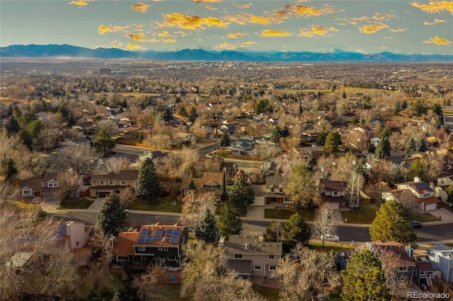 birds eye view of property with a mountain view